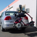 TRILIFT Ultra Lite carrying a Golden Tech Liteway on a Honda Civic.